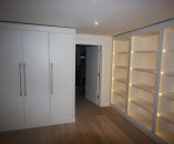 Unit Forms Passageway with Bookcase Opposite