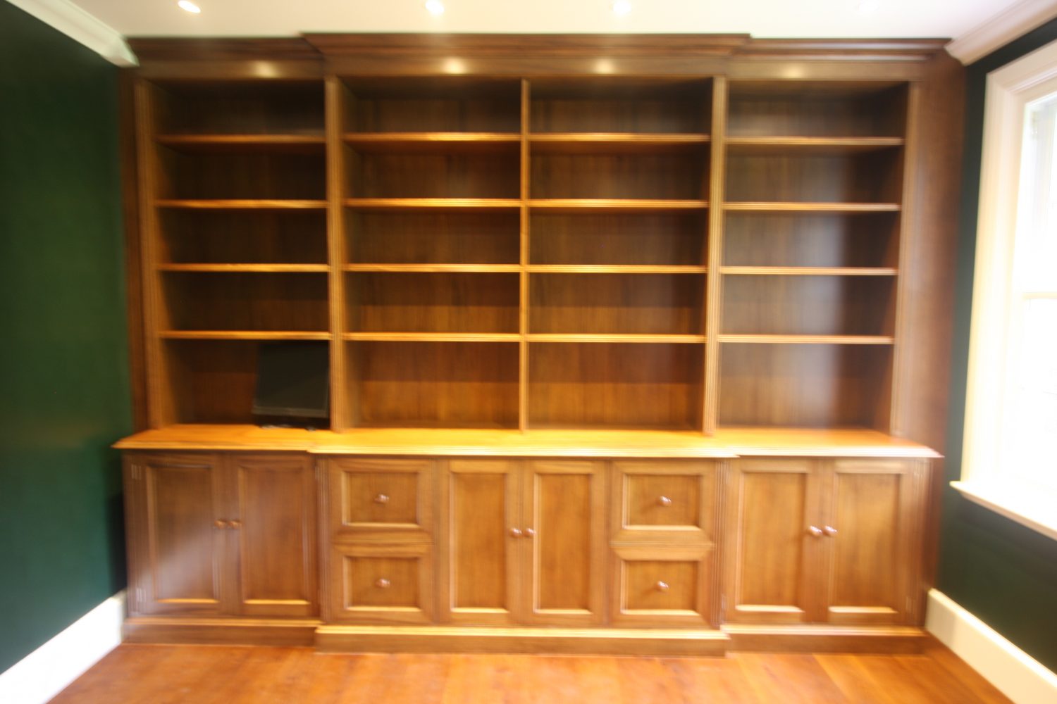 Bookcase with cupboards below