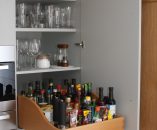 Larder cupboard with pull out tray